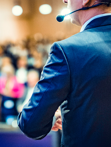 Conference speaker presenting at a conference session