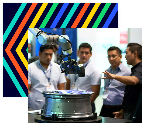 An exhibitor introducing a robot to three show attendees